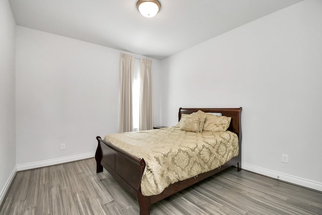 bedroom with wood-type flooring