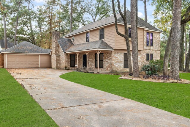 view of front of home featuring a garage and a front yard