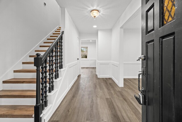 entrance foyer featuring hardwood / wood-style floors