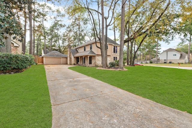 view of front of home with brick siding, a front yard, fence, and an outdoor structure