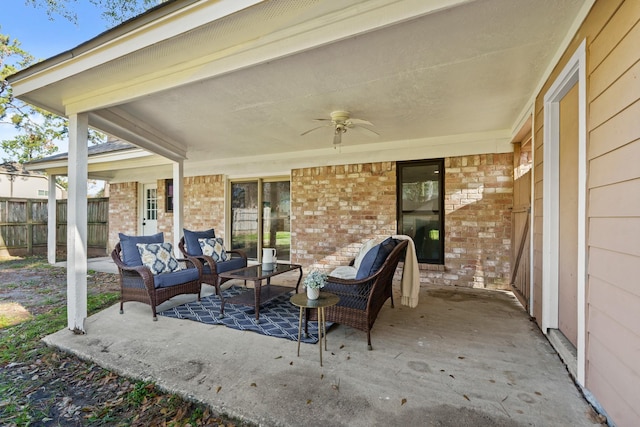 view of patio featuring outdoor lounge area, fence, and a ceiling fan