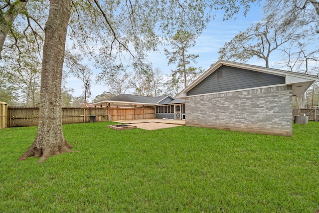 back of house featuring a patio and a lawn