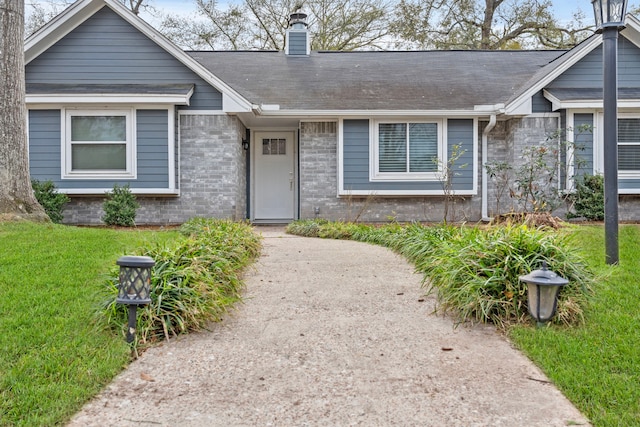 ranch-style house with a front yard