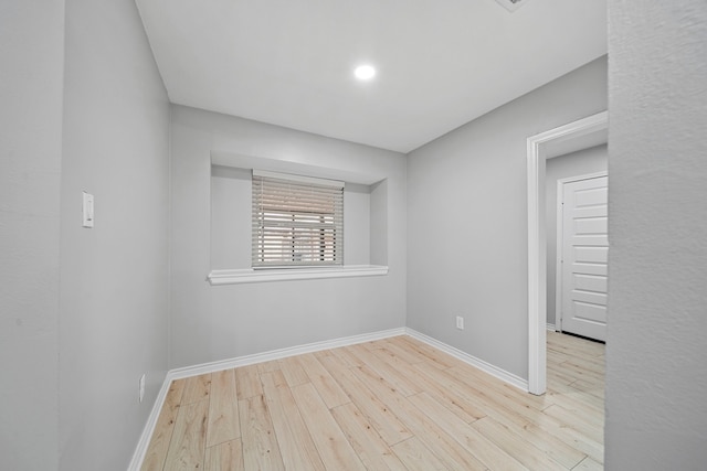 spare room with light hardwood / wood-style floors