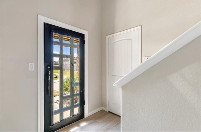 doorway to outside with light hardwood / wood-style floors