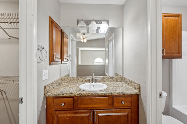 bathroom with toilet and vanity