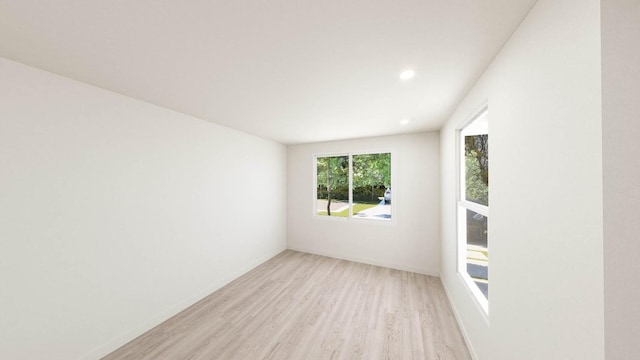 spare room with light wood-type flooring