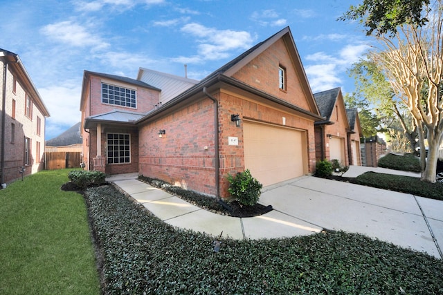 view of front facade with a garage and a front lawn