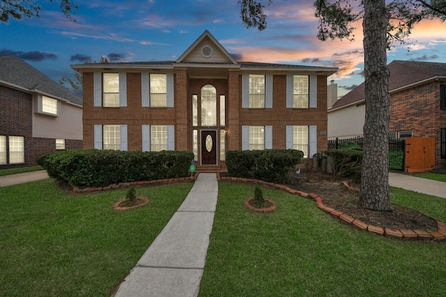 view of front of property with a yard