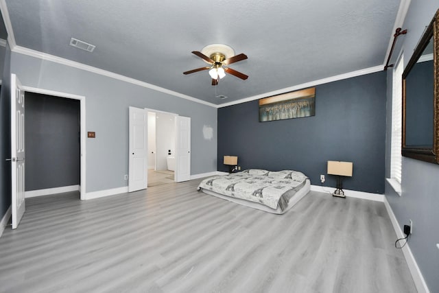 bedroom with crown molding, ceiling fan, and light wood-type flooring