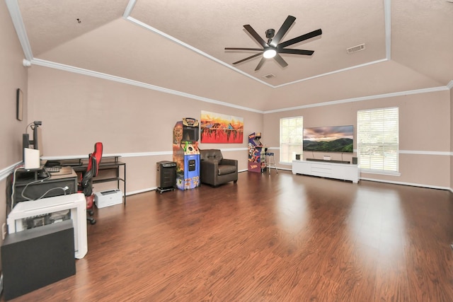 interior space with hardwood / wood-style flooring, ceiling fan, a tray ceiling, ornamental molding, and vaulted ceiling