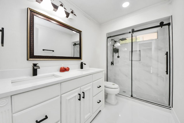 bathroom with vanity, toilet, crown molding, and a shower with shower door