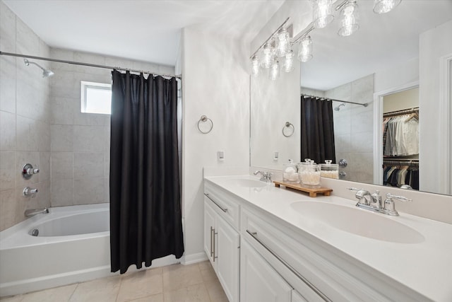 bathroom with tile patterned floors, shower / bath combo, and vanity