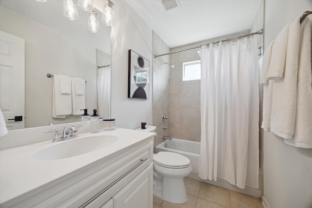 full bathroom featuring toilet, shower / bath combo, vanity, and tile patterned floors