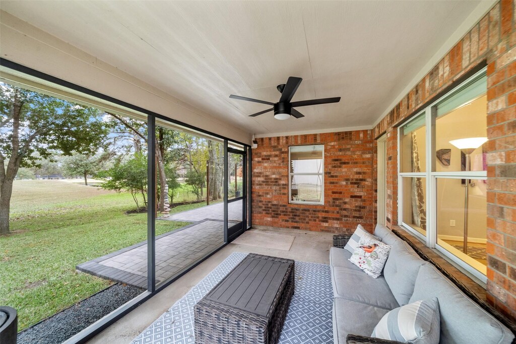 sunroom / solarium with ceiling fan