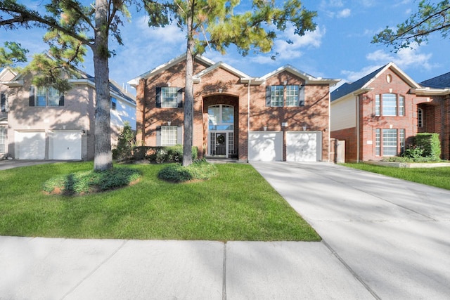 view of front of home featuring a garage and a front lawn