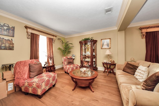 living room featuring light hardwood / wood-style floors and crown molding