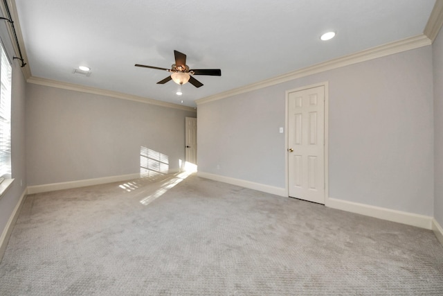 unfurnished room featuring ceiling fan, a wealth of natural light, and crown molding