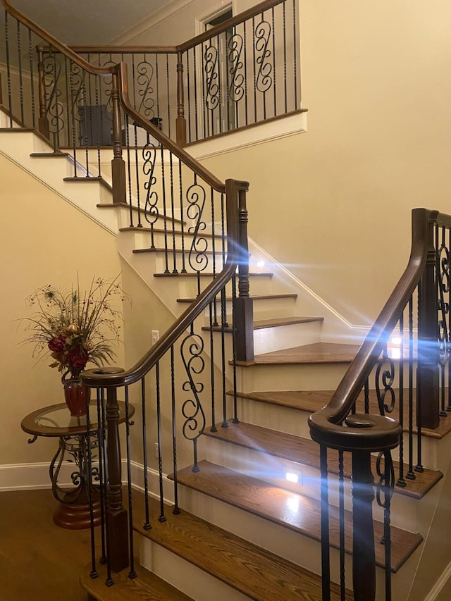 stairway featuring hardwood / wood-style floors