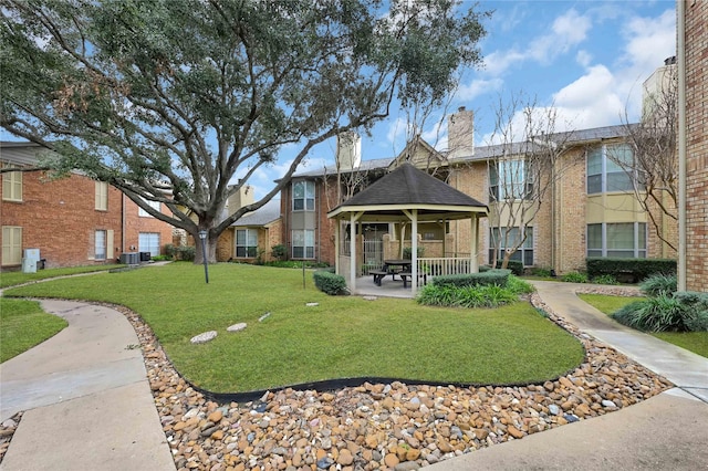 surrounding community featuring a gazebo and a lawn