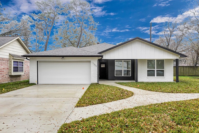 ranch-style home with a garage and a front yard