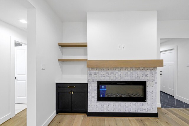 interior space featuring a fireplace and light hardwood / wood-style floors