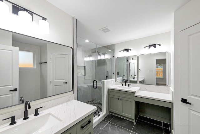 bathroom featuring vanity and a shower with door