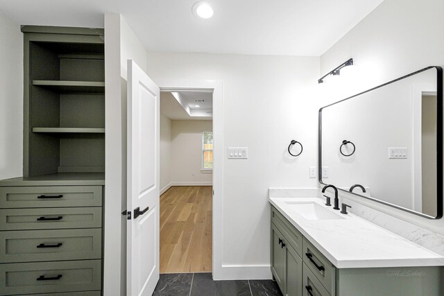 bathroom with vanity and hardwood / wood-style flooring