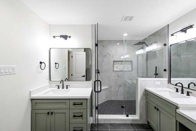 bathroom featuring vanity and a shower with shower door