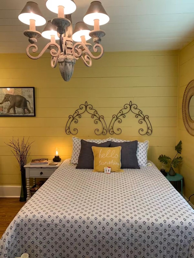 bedroom with dark hardwood / wood-style floors