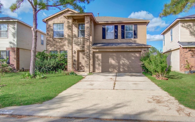 view of front of home with a front yard and a garage