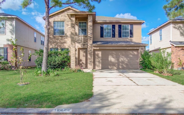 view of front facade with a front lawn and a garage