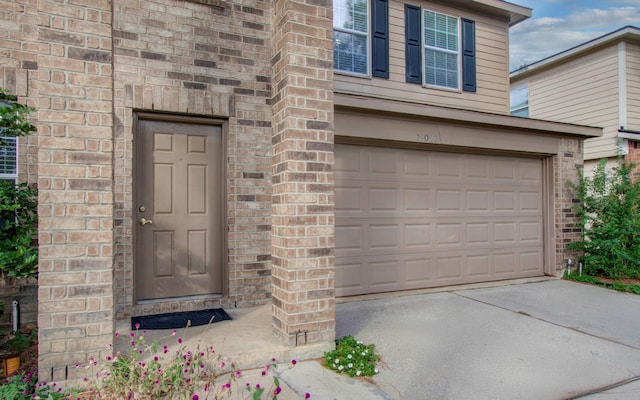 entrance to property featuring a garage