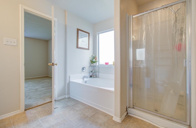 bathroom with separate shower and tub