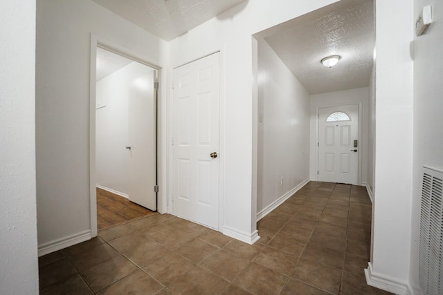 interior space featuring a textured ceiling