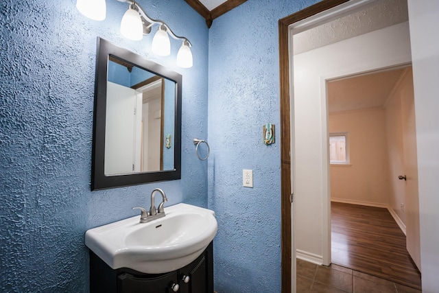 bathroom featuring tile patterned flooring and vanity