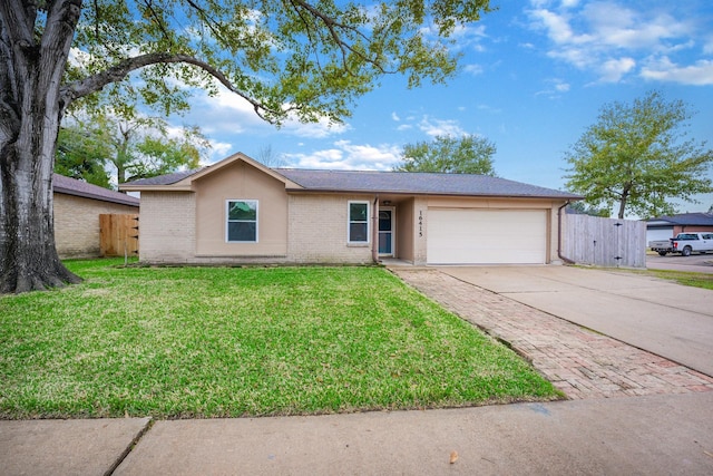 ranch-style home featuring a front lawn and a garage