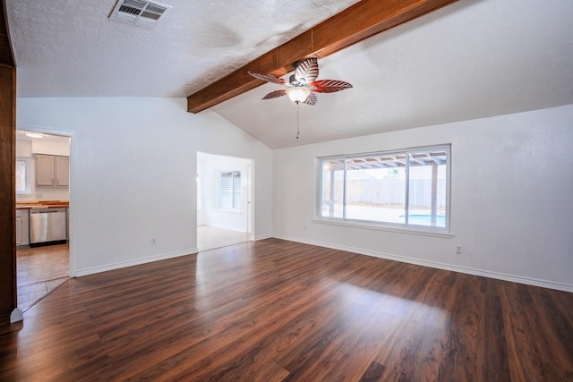 unfurnished living room featuring a textured ceiling, ceiling fan, vaulted ceiling with beams, and hardwood / wood-style floors