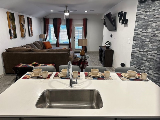 kitchen with vaulted ceiling and ceiling fan