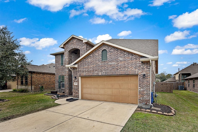 view of front of property featuring a front lawn, central AC unit, and a garage