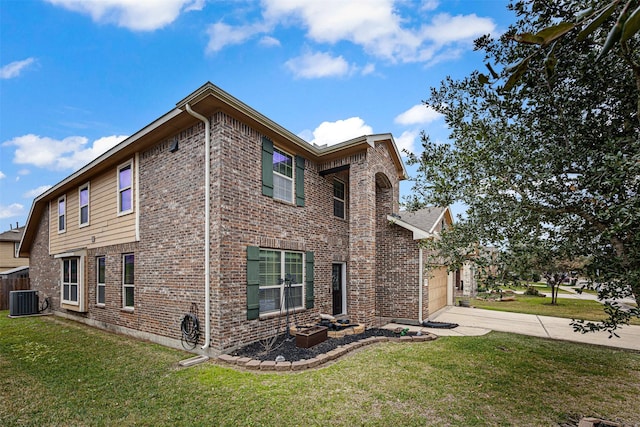 view of side of property featuring a garage, central AC, and a lawn