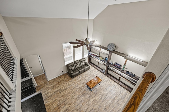 living room with high vaulted ceiling