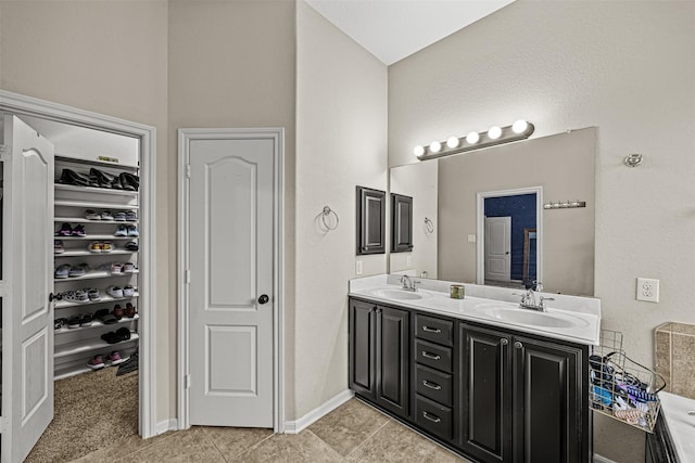 bathroom featuring vanity and tile patterned flooring