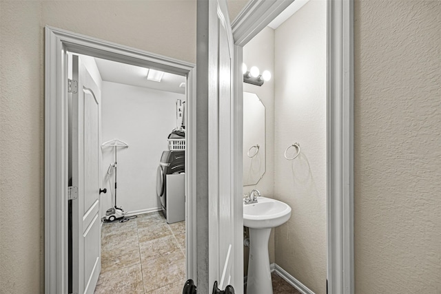 bathroom featuring washer / dryer and sink