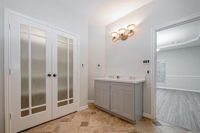 bathroom with sink and french doors