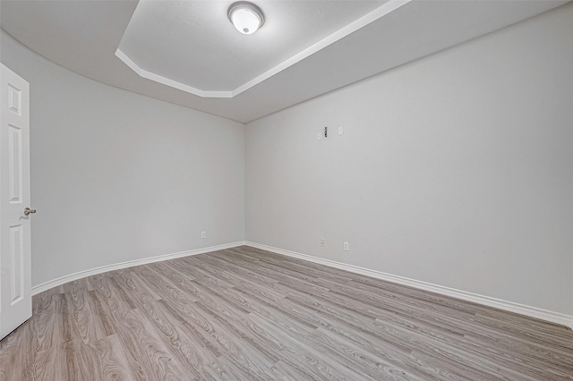 empty room with light hardwood / wood-style flooring