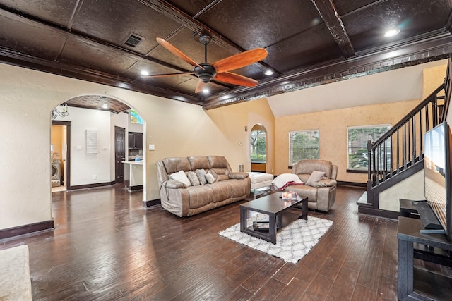 living room with washer / clothes dryer, dark hardwood / wood-style flooring, ceiling fan, and ornamental molding