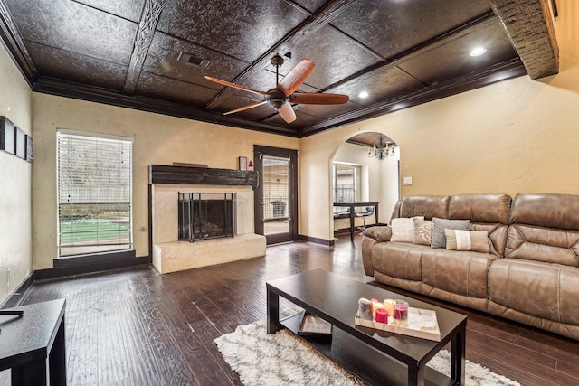 living room with ceiling fan, crown molding, hardwood / wood-style floors, and a high end fireplace