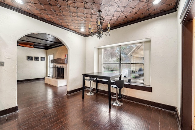 dining space with ornamental molding and wood-type flooring