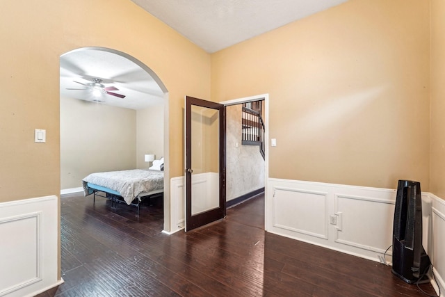 bedroom with ceiling fan and dark hardwood / wood-style flooring